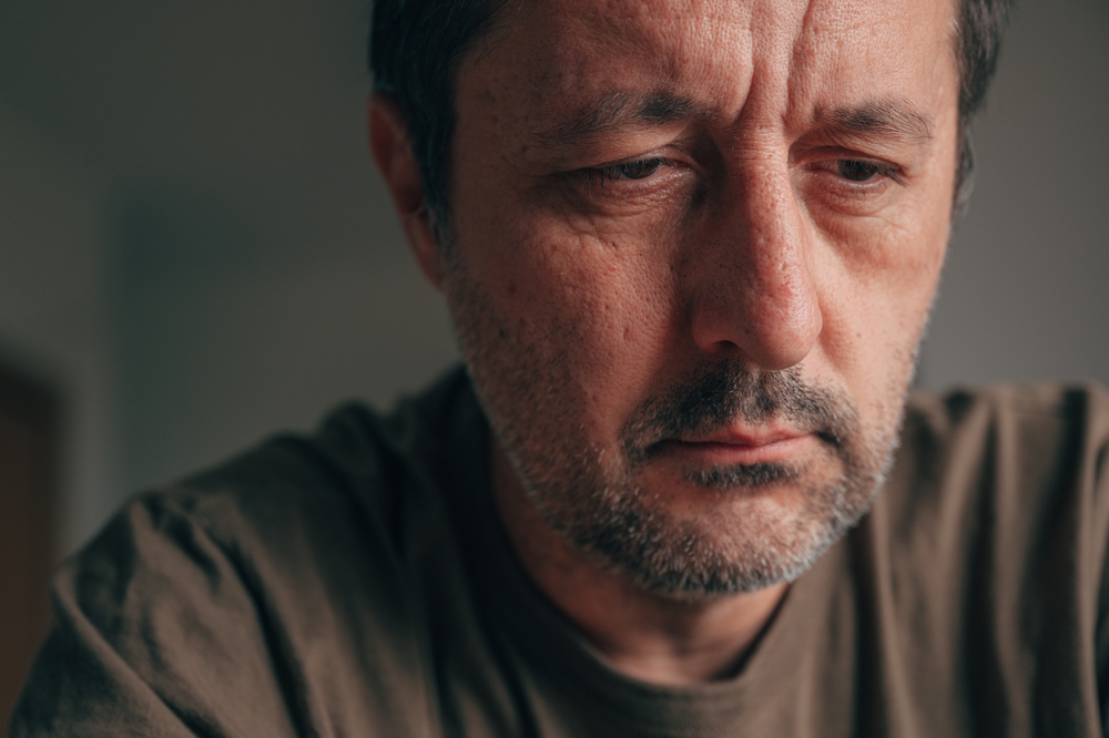 Closeup,Headshot,Portrait,Of,A,Discouraged,Mature,Adult,Man,Looking