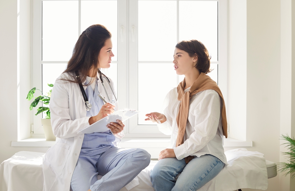 Young,Female,Gp,Doctor,Talking,To,Patient,,Explaining,Prescription,,Medical