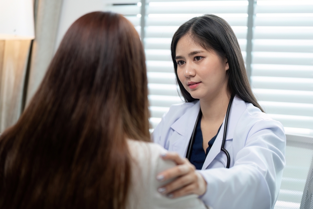 Compassionate,Doctor,Consulting,With,Patient,In,Modern,Medical,Office,For