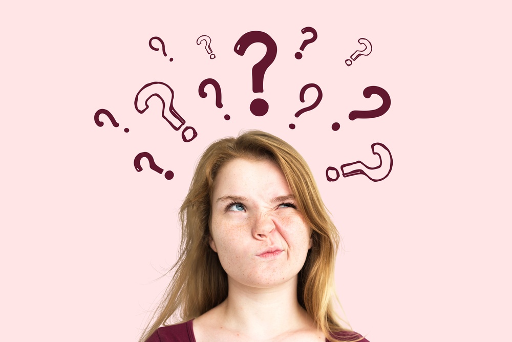 A,Person,With,Long,Hair,Looks,Puzzled,,Surrounded,By,Drawn