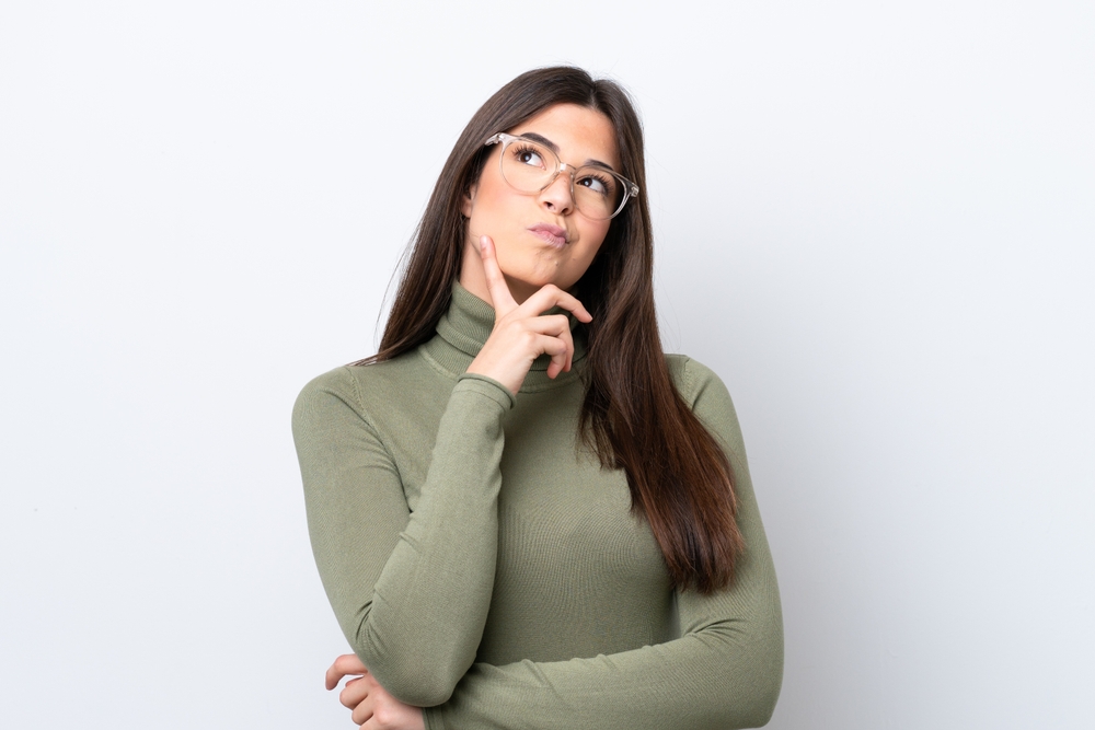 Young,Brazilian,Woman,Isolated,On,White,Background,Having,Doubts,While